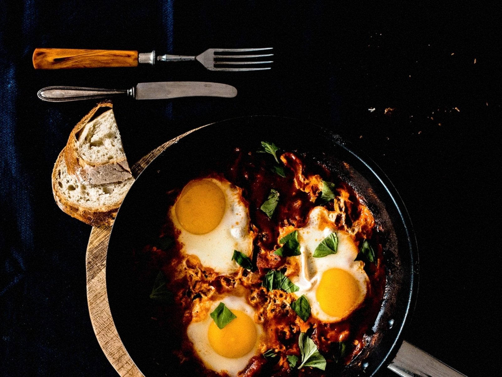 Shakshuka served warm in a small pan at Zellige